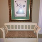 white-bench-with-upholstered-seat-and-large-framed-print